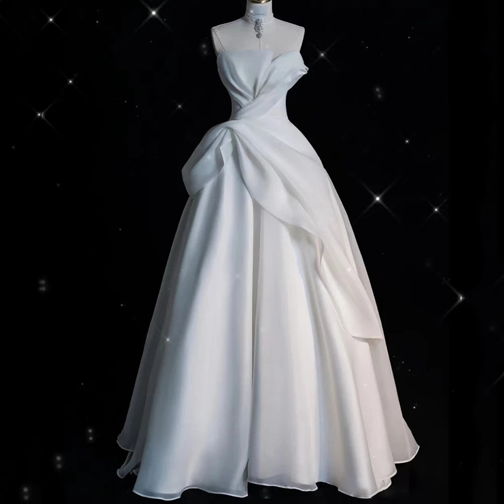 drape design dress This new drape design celebrates the natural fluidity of silk. Delicate  pleats sweep from the left shoulder, flowing gracefully across the body  before cascading into an elegant finish at the right hip