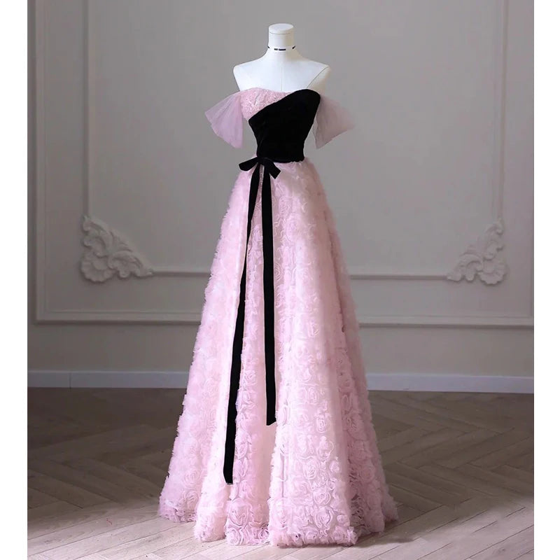 Strapless Pink Gown With Black Bow Accent